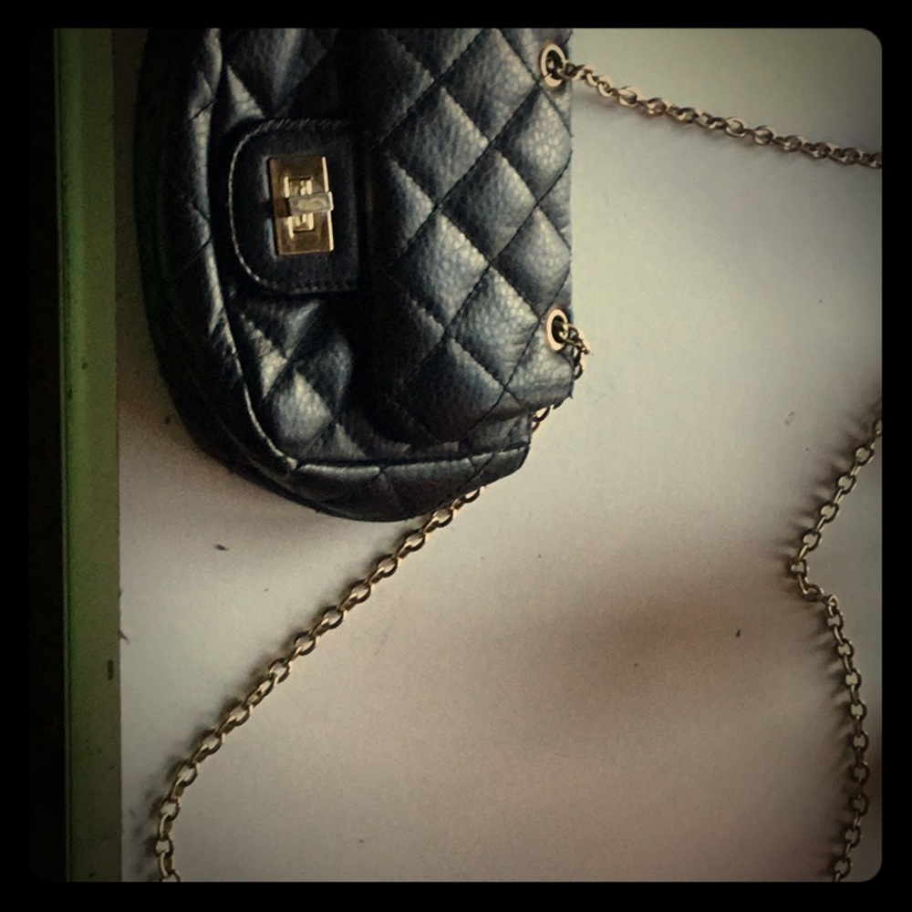 Small black hand bag with gold shoulder chain